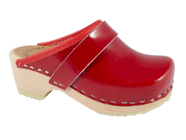 Children in red patent leather clogs